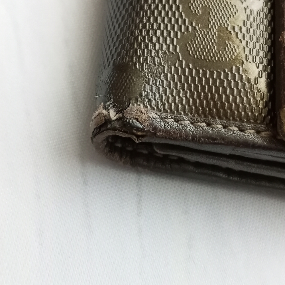 Authentic Gucci Metallic brown Signature wallet with GG charm - Picture 4 of 16